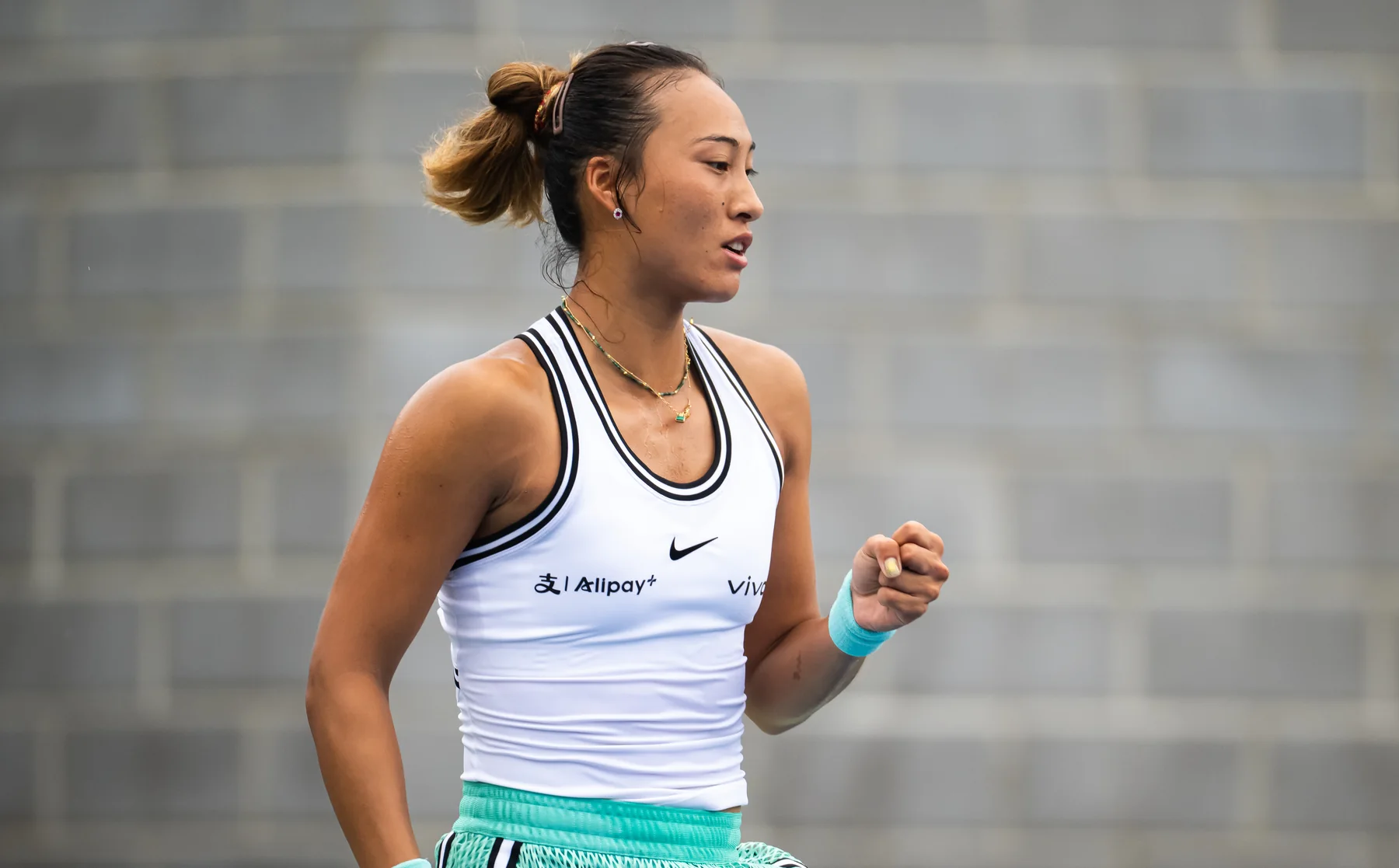 Zheng Qinwen striking a ball during the 2026 US Open qualifying tournament