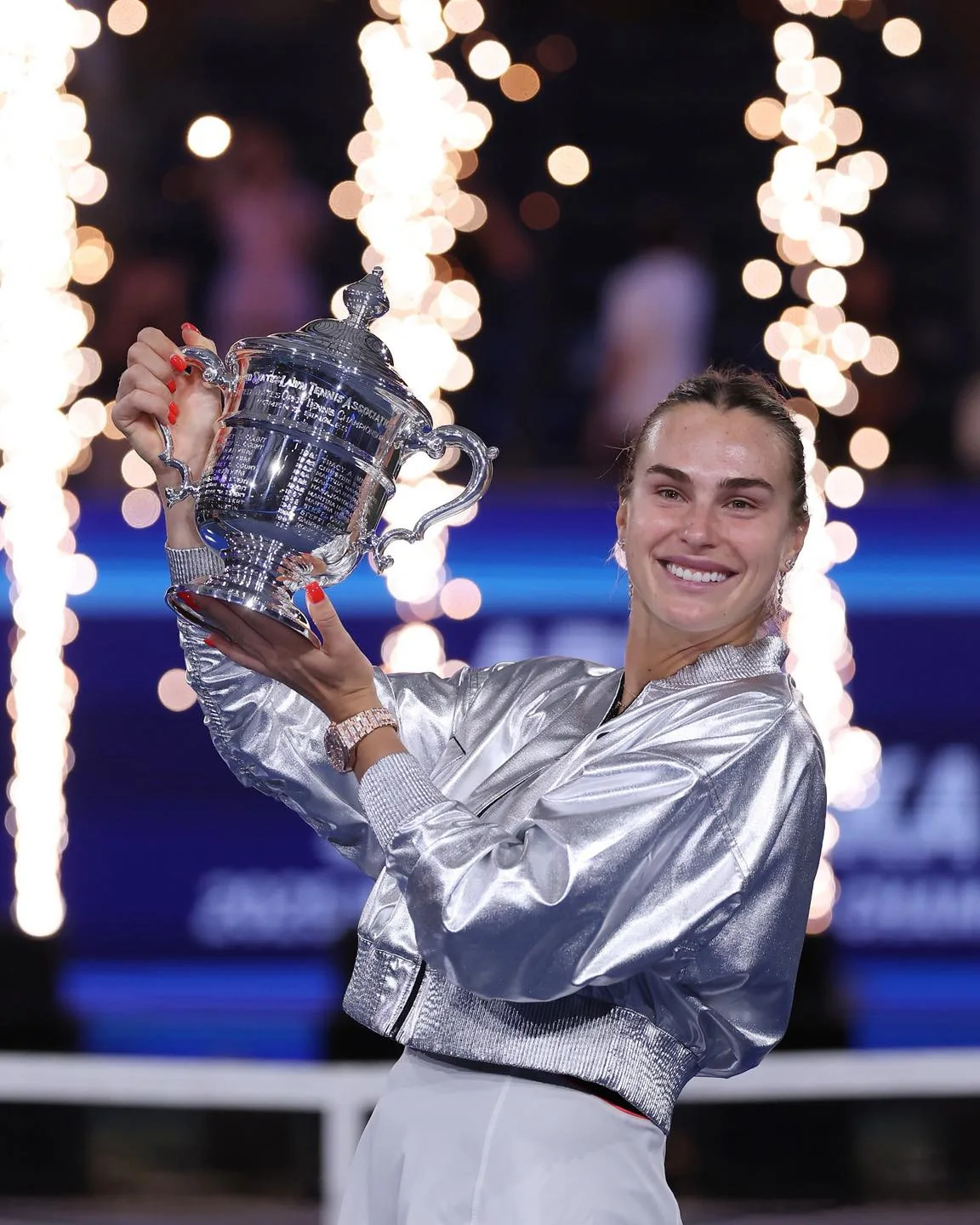 Aryna Sabalenka holding the women's singles trophy after winning the 2025 US Open