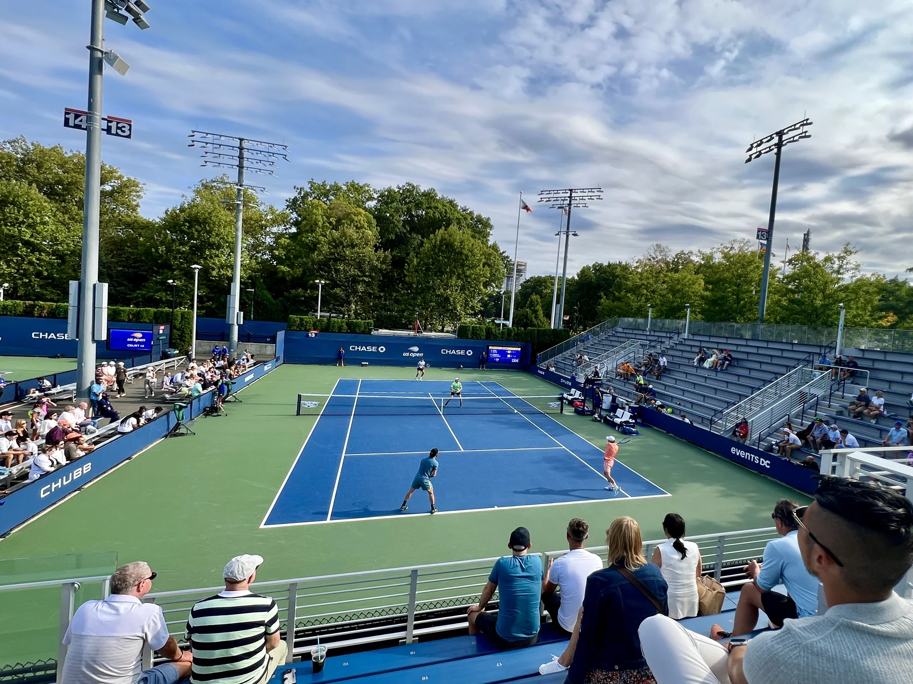 A men's doubles match being played on an outer court at the 2025 US Open
