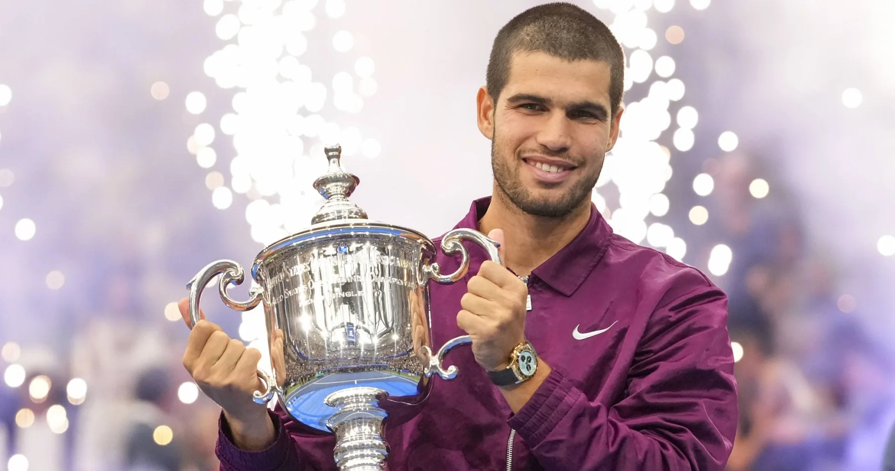 Carlos Alcaraz celebrating with the men's singles trophy after the 2025 US Open